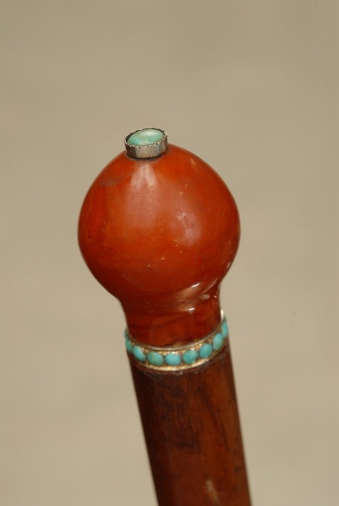 A lovely Turkish amber cane with turquoise highlights: A wonderful Turkish amber cane with turquoise highlights. The Turkish amber knob handle is 1 7/8" high and 1 1/4" at its widest. The opaque amber is surmounted with a 1/4" cabochon turquoise stone set
