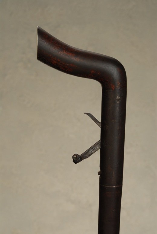 A Moses Babcock underhammer percussion gun cane curio: A fine Moses Babcock underhammer percussion gun cane curio. Made entirely of metal, it has an “L” handle that measures 4 1/2” long. It has a silver end-cap that measures 1 1/2” and there are r