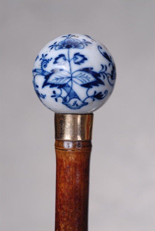 A Meissen porcelain blue and white ball cane: A lovely Meissen porcelain blue and white ball cane. The ball handle is 1 1/2" in diameter. It is foliate and scroll decorated in blue, on a white background. (A small crossed sword Meissen mark, with