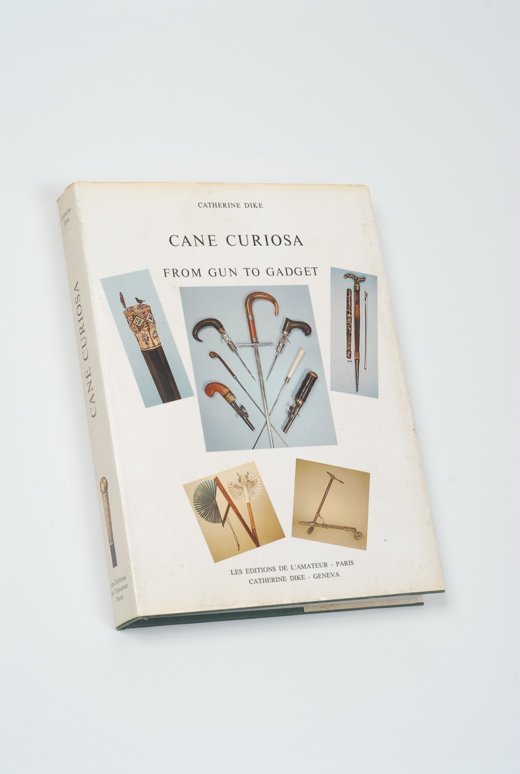 A copy of Cane Curiosa, From Gun to Gadget: A hardbound copy of Cane Curiosa, From Gun to Gadget, by Catherine Dike. Long considered to be the very best resource for gadget or system canes, it is now out of print and is becoming more and more s
