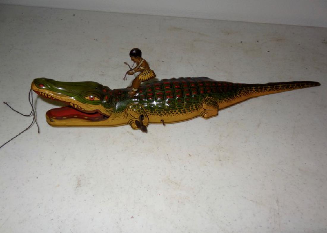 Boy on Alligator Tin Toy (1 of 3)