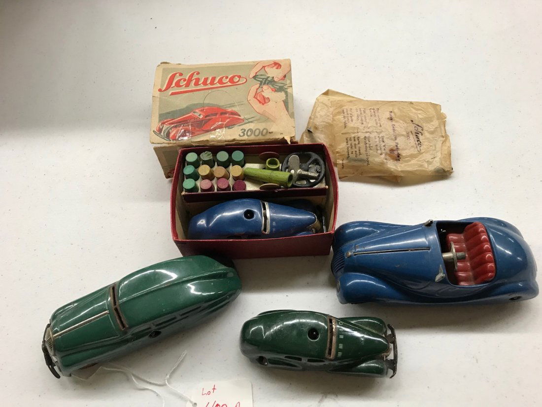 4 Schuco Toy Cars: The largest car is 7" X 3" wide.
