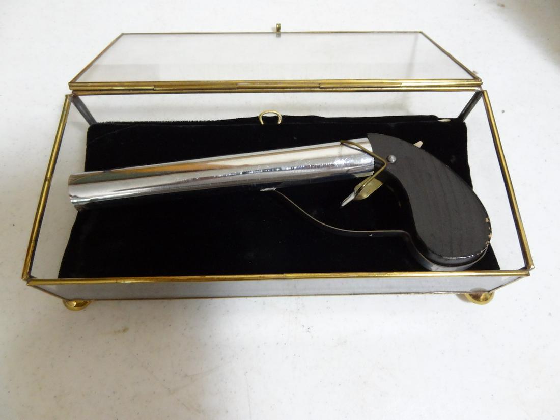 souvenier "Bang" pistol toy: silk flag; 9" long