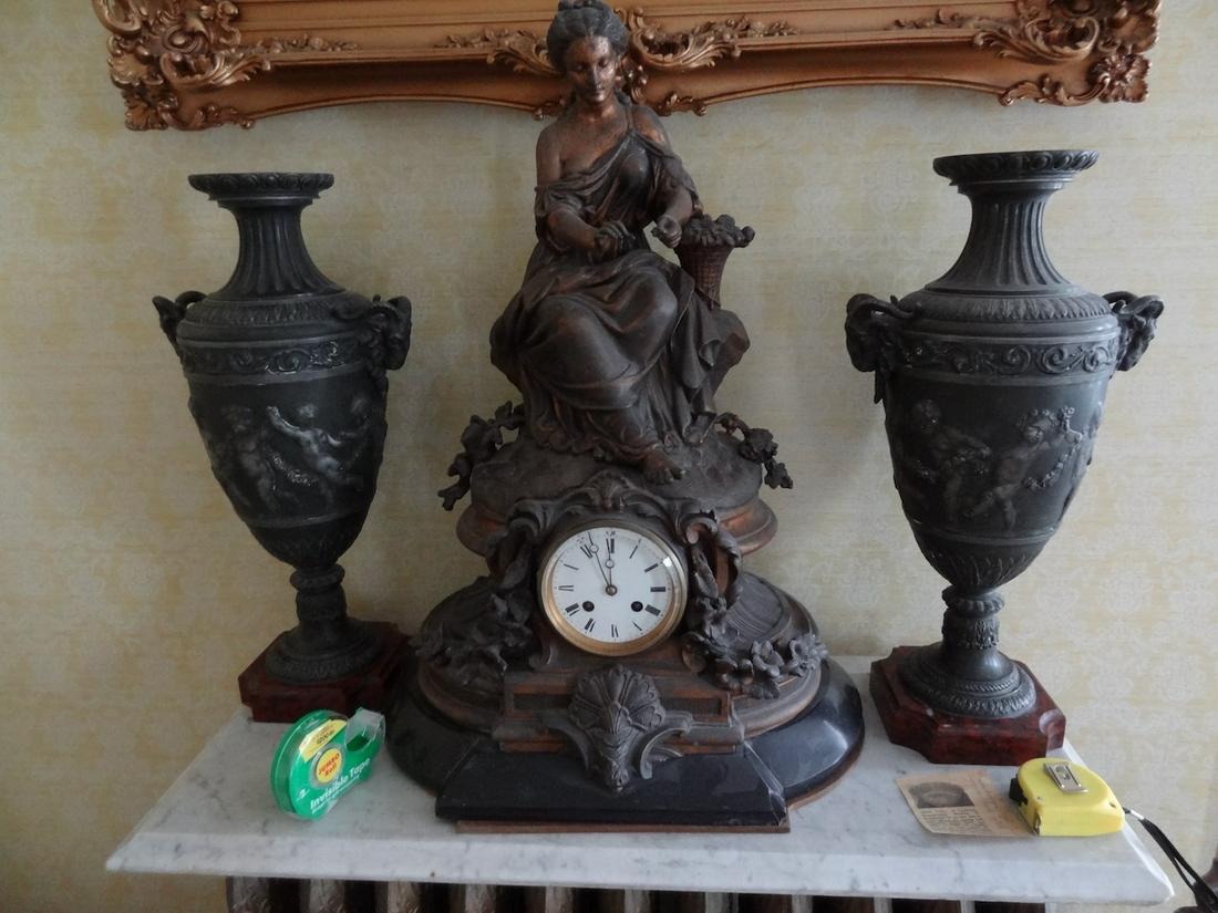 Large figural clock w/ pr. Cupid urns (1 of 1)