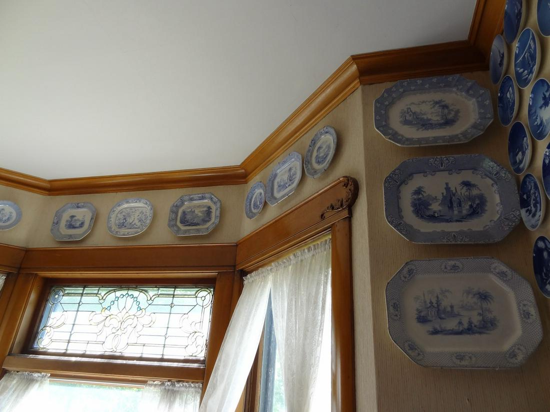 Wall of transferware platters (1 of 3)