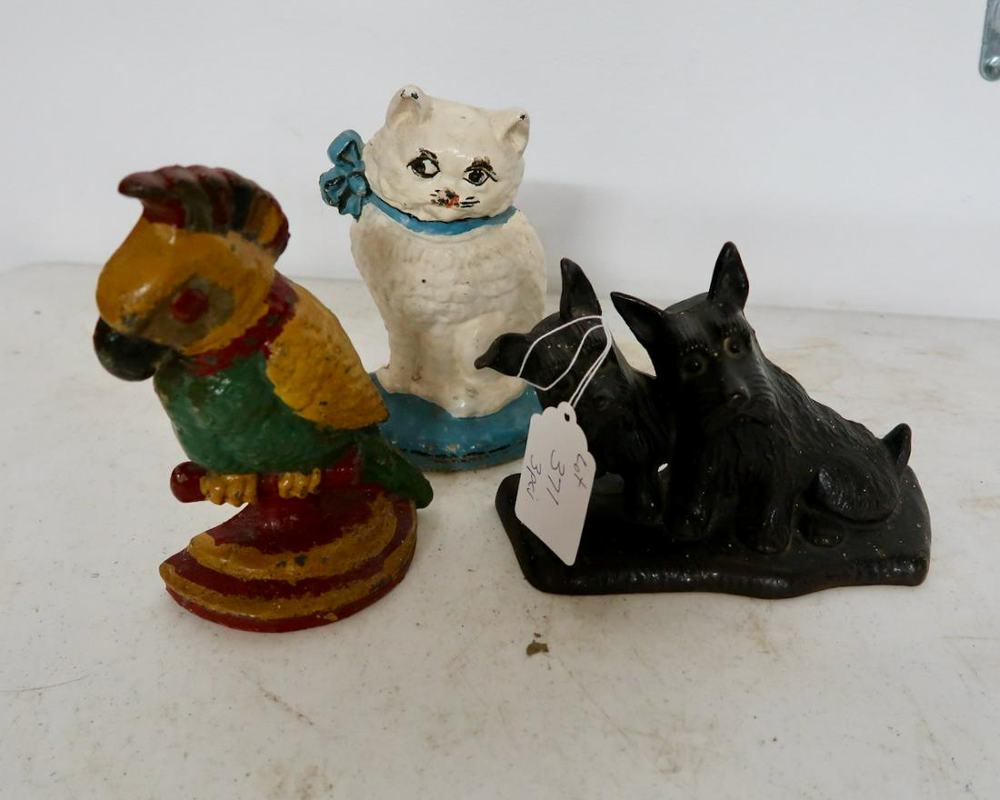 3 Cast Iron Doorstops: One Dated 31- Tallest 8"