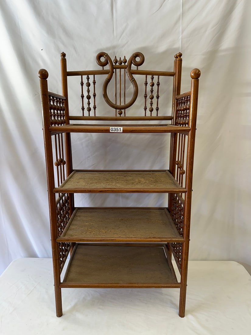 Antique Wooden Lyre-Backed Bookshelf: Elegant antique wooden bookshelf featuring a unique lyre design. Perfect for displaying books or collectibles, this piece adds a touch of classic charm to any room. Ideal for antique lovers and vintag