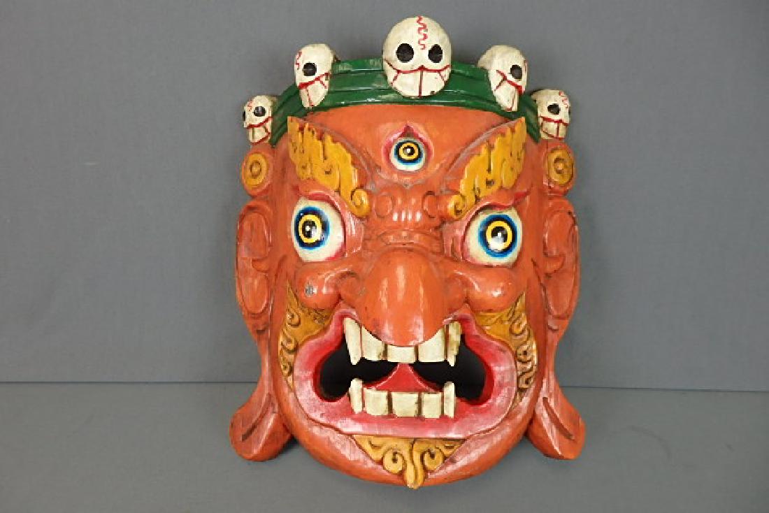 Orange Tibetian Mahakala Mask: Was bought in 2013 for $160. Hand carved in Nepal in 1995. 13 inches in length by 12 inches wide with a depth of roughly 5.5 inches.