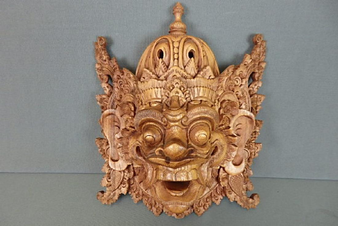 Bali Evil King Wood Mask: Two piece construction. One for the crown and the mask itself. Back is marked Subrata Bali with a sticker from Novica Collection Indonesia. Length is 11 inches by 9 inches wide with a depth of roughly