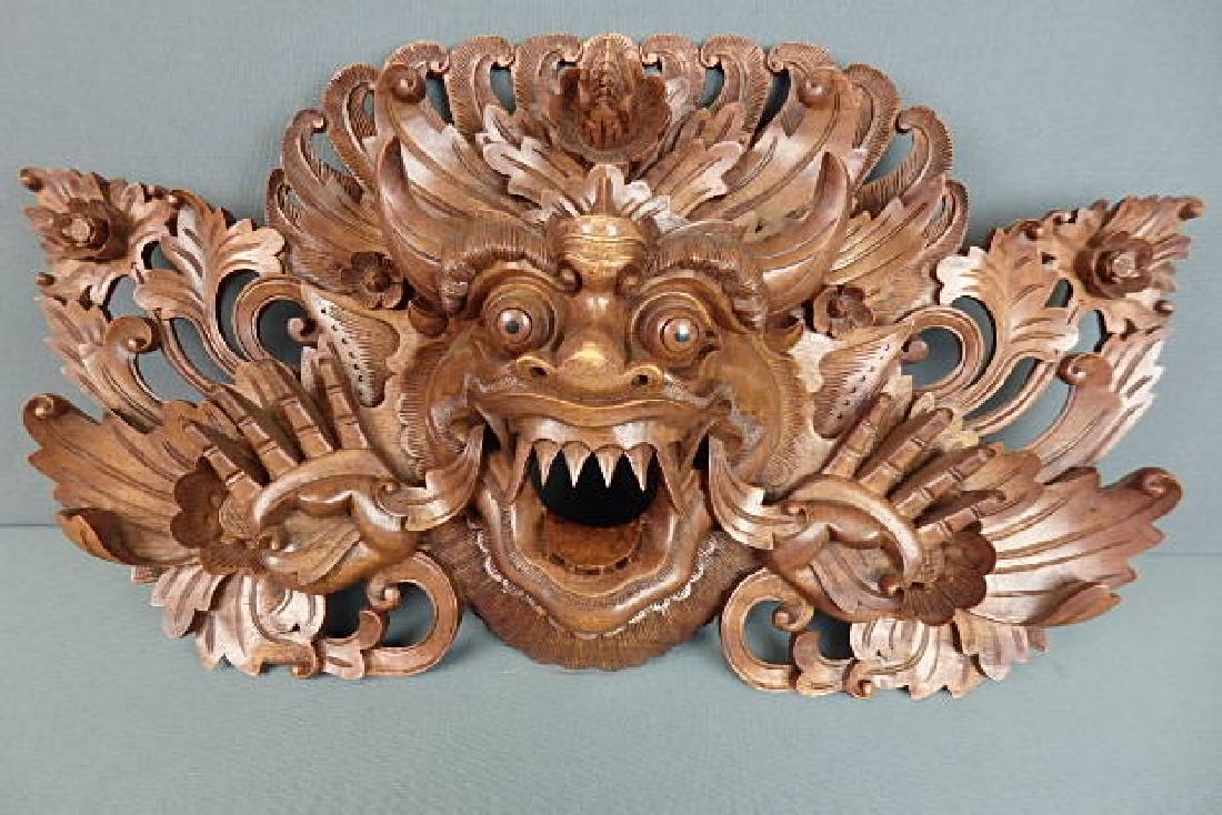 Bali Barong Mask Wooden: 2 piece construction. One for the piece and another for the hang part on the backside of it. Back is carved pastika. There is a sticker from Novica Collection Indonesia. Donâ€™t see any damage on