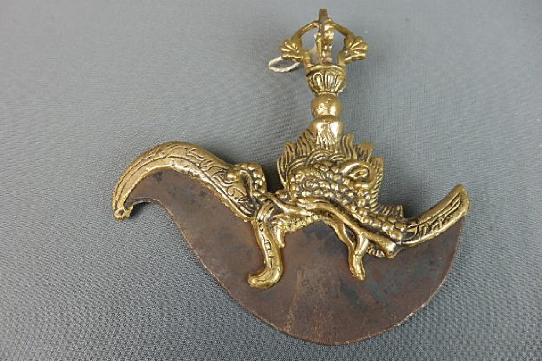 Brass Ceremonial Knife: Roughly cast brass. Size is 7 inches in height by 7 inches in width. There is no markings on it.