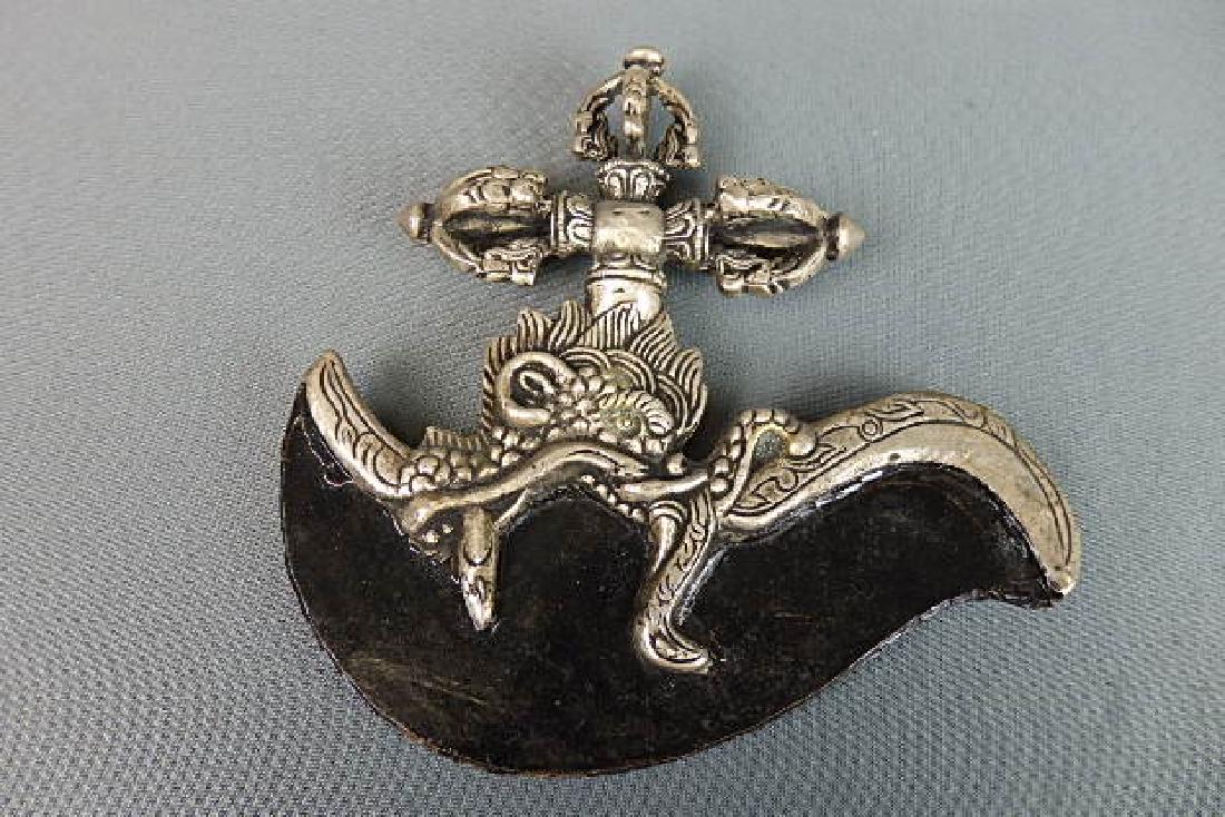 Cast Ceremonial Knife: Roughly cast metal. Size is 7 inches in height by 7 inches in width. There is no markings on it.