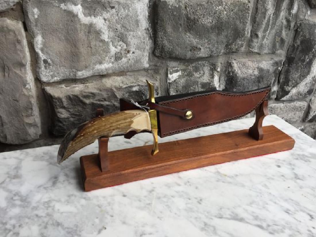 Knife with Leather Sheath: Knife with Leather Sheath by Jaged, decorated horn handle with buck, artist signed Semich,15" including blade, 8" untouched blade, with stand