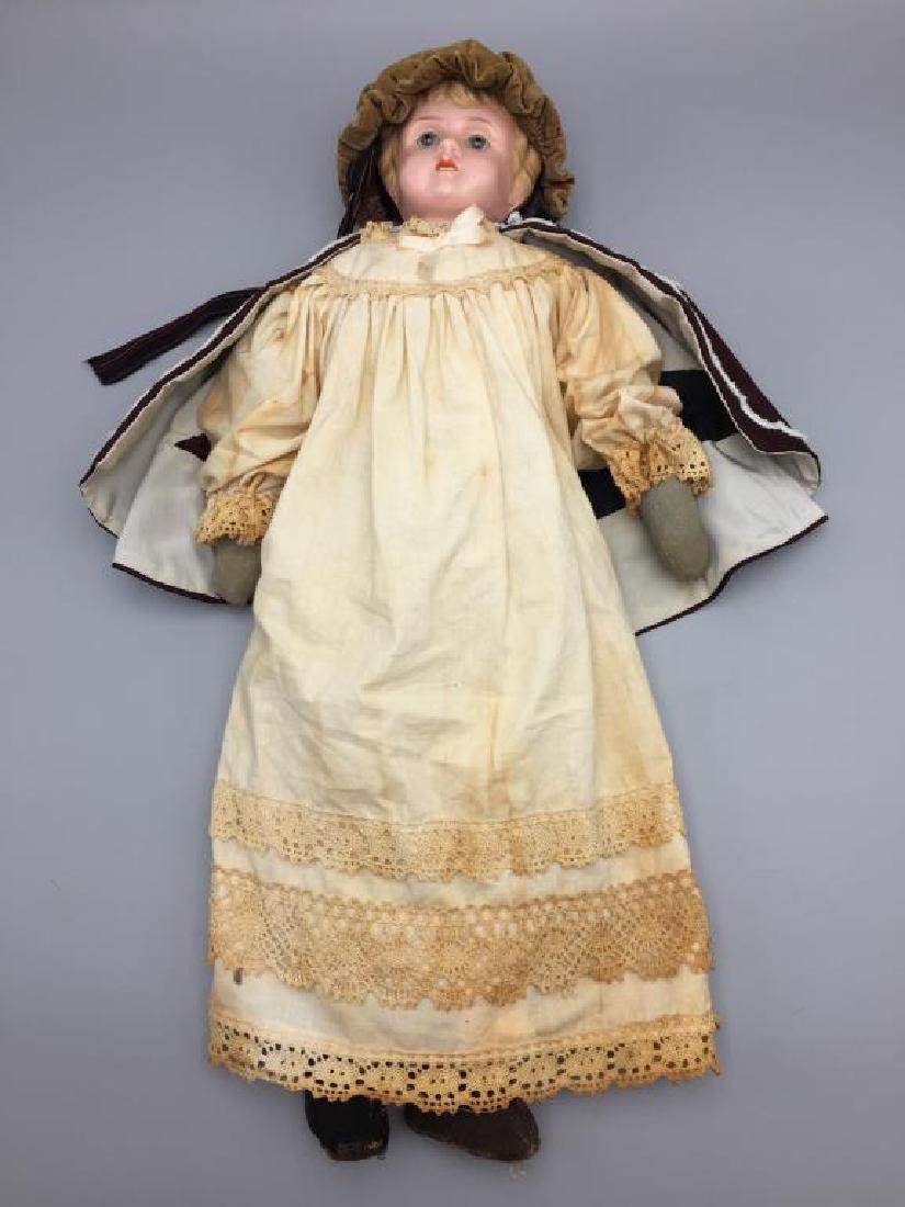 Early made in Germany tin Head doll: Victorian era doll with open mouth, teeth and porcelain eyes, she is 22 inches in length.