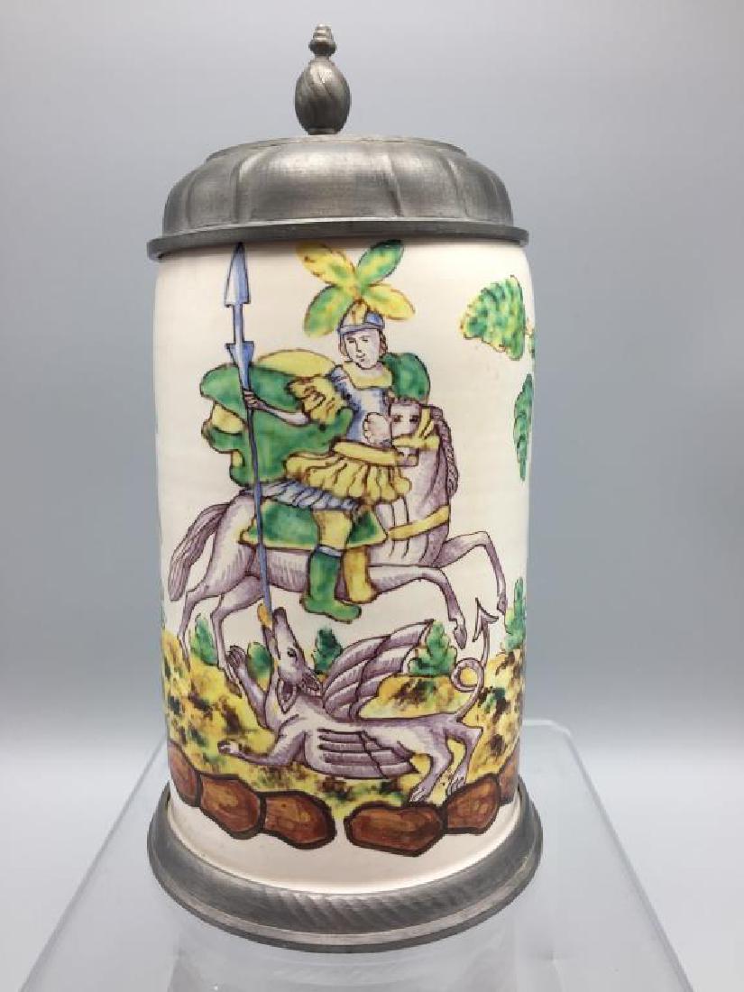 French Faience Stein: depicting knight fighting a winged beast, pewter lid,no chips or no cracks, marked on base with sword 738, 8 inches