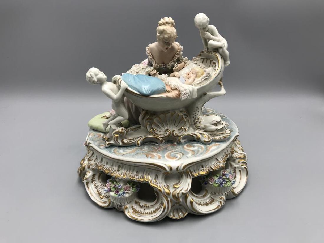 Capodimonte mother and baby figurine: some damage to the petals on the flowers. Size is 9 inches across.