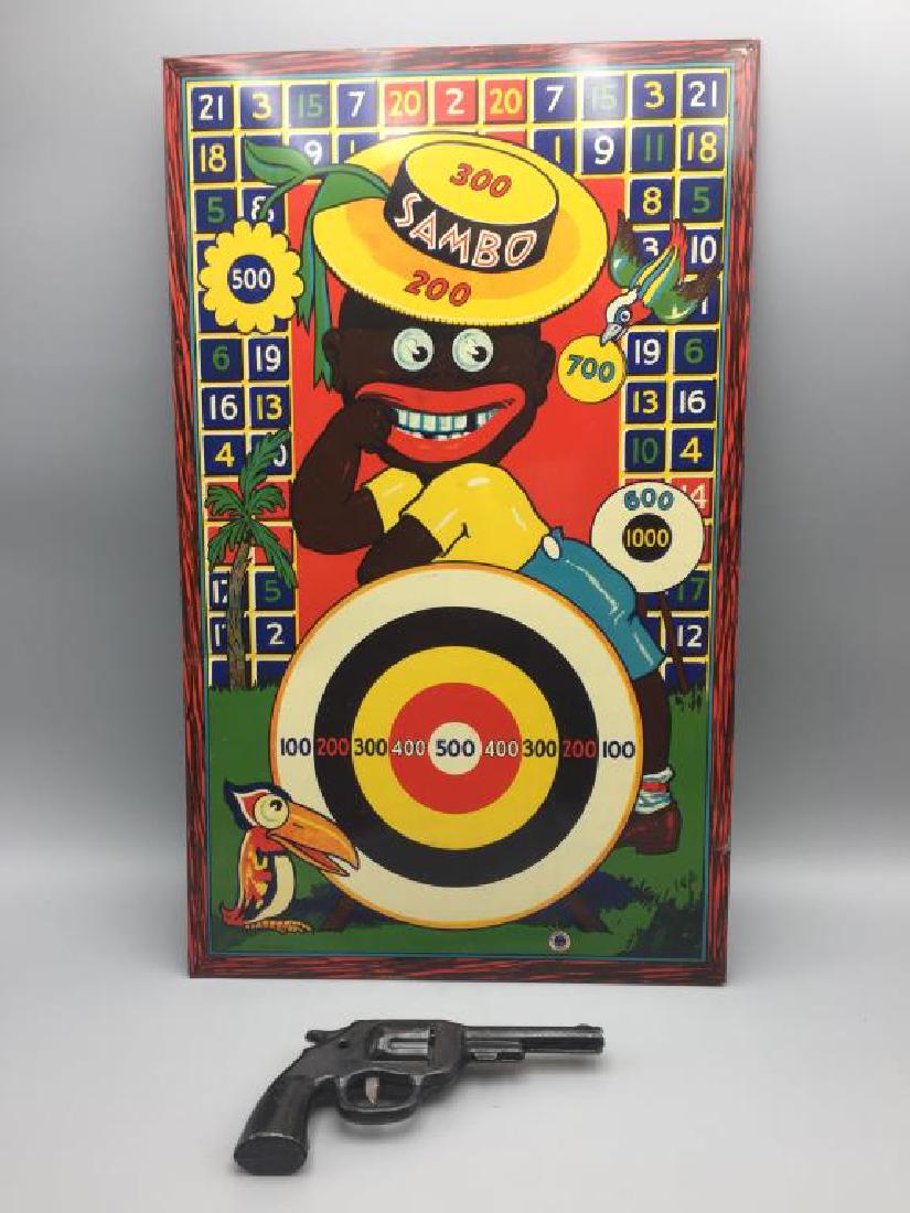 Wyandotte Little Black Sambo Target game: Tin target, no darts but has the gun. Colors are still nice and bright. Size is 23 inches long.