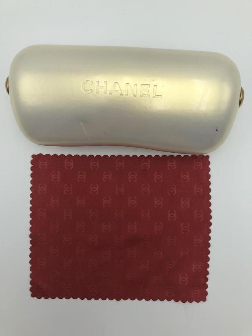 Chanel eyeglass case: pearl luminance case with gold studs accent and red chanel eyeglass cloth.