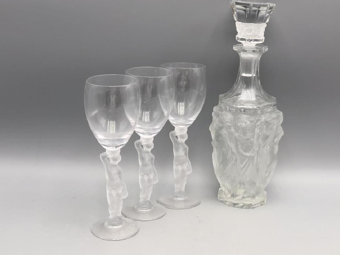 Czech Frosted Glass Decanter and Wine Glasses: Decanter has 8 frosted figural nude females with flowing hair, the top features carving of 5 female faces with same features. Topper is labeled Made in Czechoslovakia. Three wine glasses have clear gl