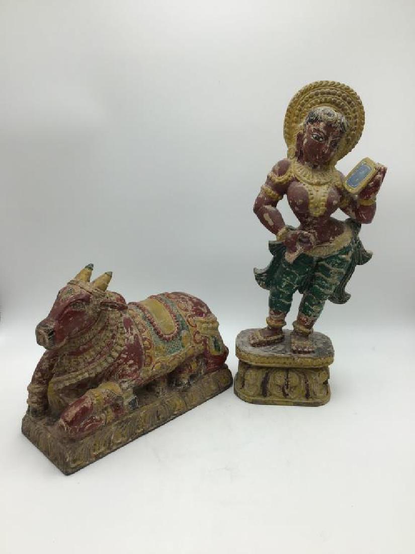 Lot of two polychrome and wood carvings: includes 18 inch tall figure of partially nude Indonesian female, 10 inches tall x 12 inches long x 5 inches wide, both with colorful polychrome decoration
