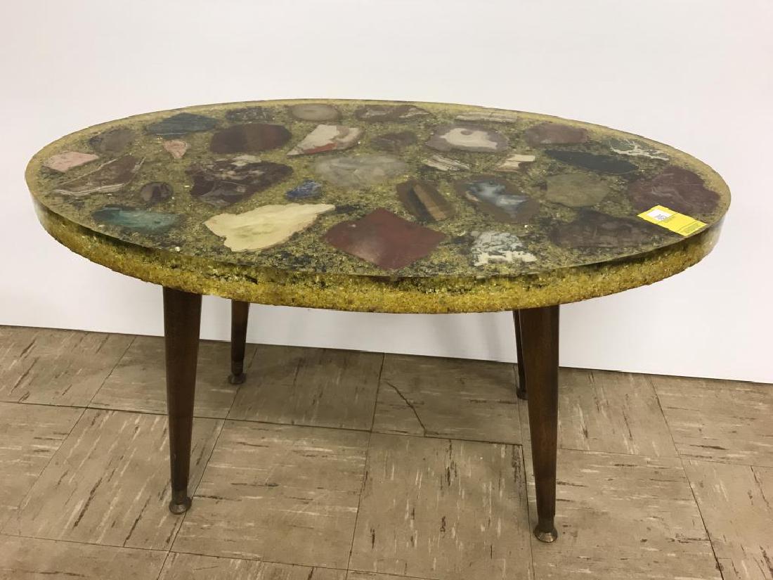 Mid Century coffee table: acrylic and sliced stone oval coffee table on for wooden legs, 17 1/2 inches tall by 30 inches long by 18 inches wide, acrylic top is 1 1/2 inches thick