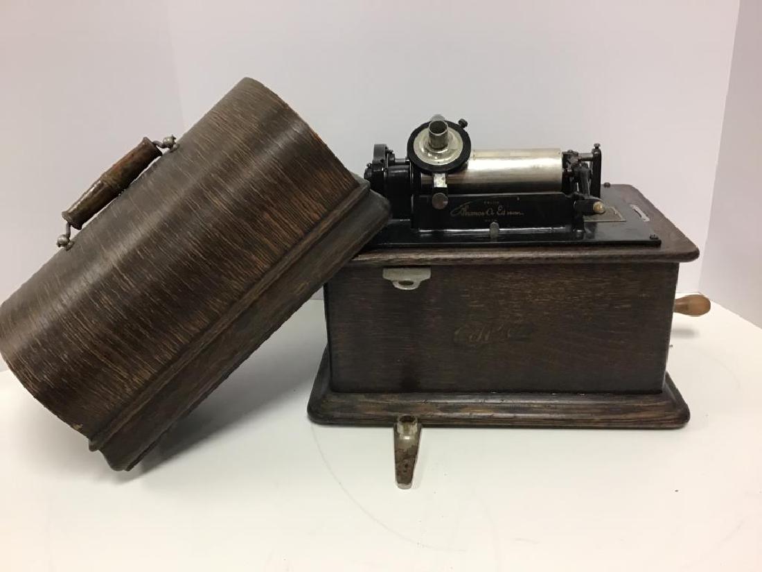 Edison Home Phonograph: as found, needs restoration, Standard Model, 2 minute machine, oak wood case with the name "Edison" printed in script on front, plate inside indicates Serial No. S349198, Dome lid locks on sides, leve