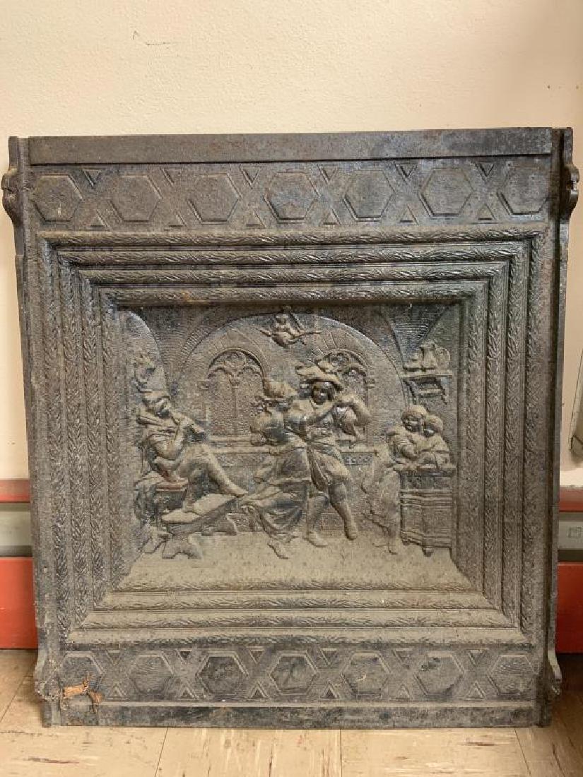 Cast iron fire back: Cast iron fire back with center image of merry dancers, measures about 30 inches high by 26 inches wide by 1 inch thick, piece is very heavy.
