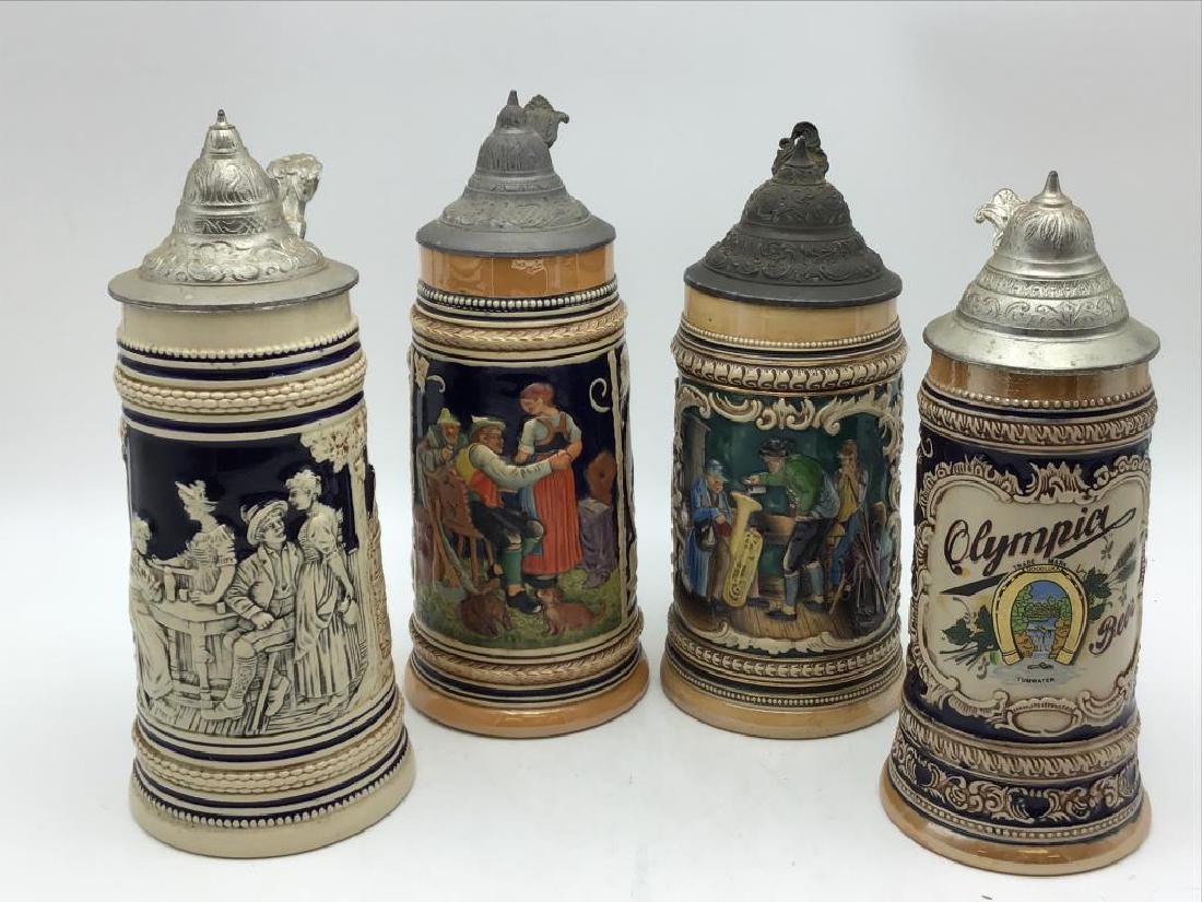 Four German Steins: Lot of four German steins, see photos for markings on bottom, largest measures about 11 inches high with 4.5 inch diameter base.