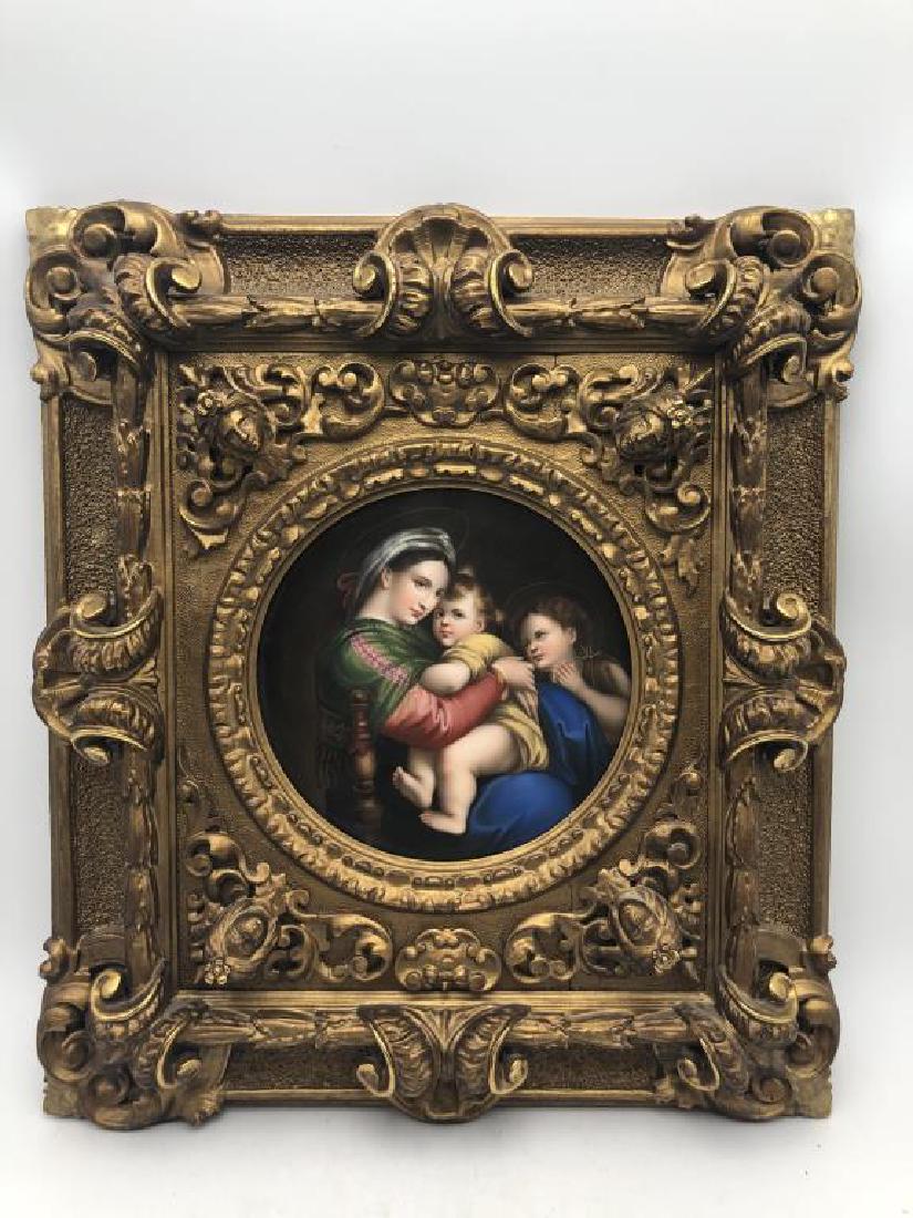 Antique KPM Porcelain Wall Hanging: Antique KPM porcelain plaque with image of Madonna and child with Saint John the Baptist set inside heavily decorated wood and gesso frame, wired for wall hanging. Frame measures about 18 inches high