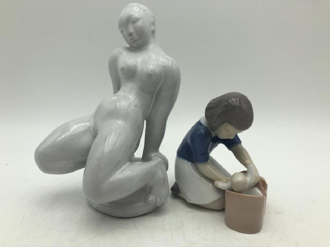 2 Porcelain Female Figurines: Lot includes a porcelain figure of mother and infant by Bing & Grondahl, bottom marked B&G 2307 F. Second figure is a white porcelain nude, signature on bottom appears to read "Danmai" measures 7 inch