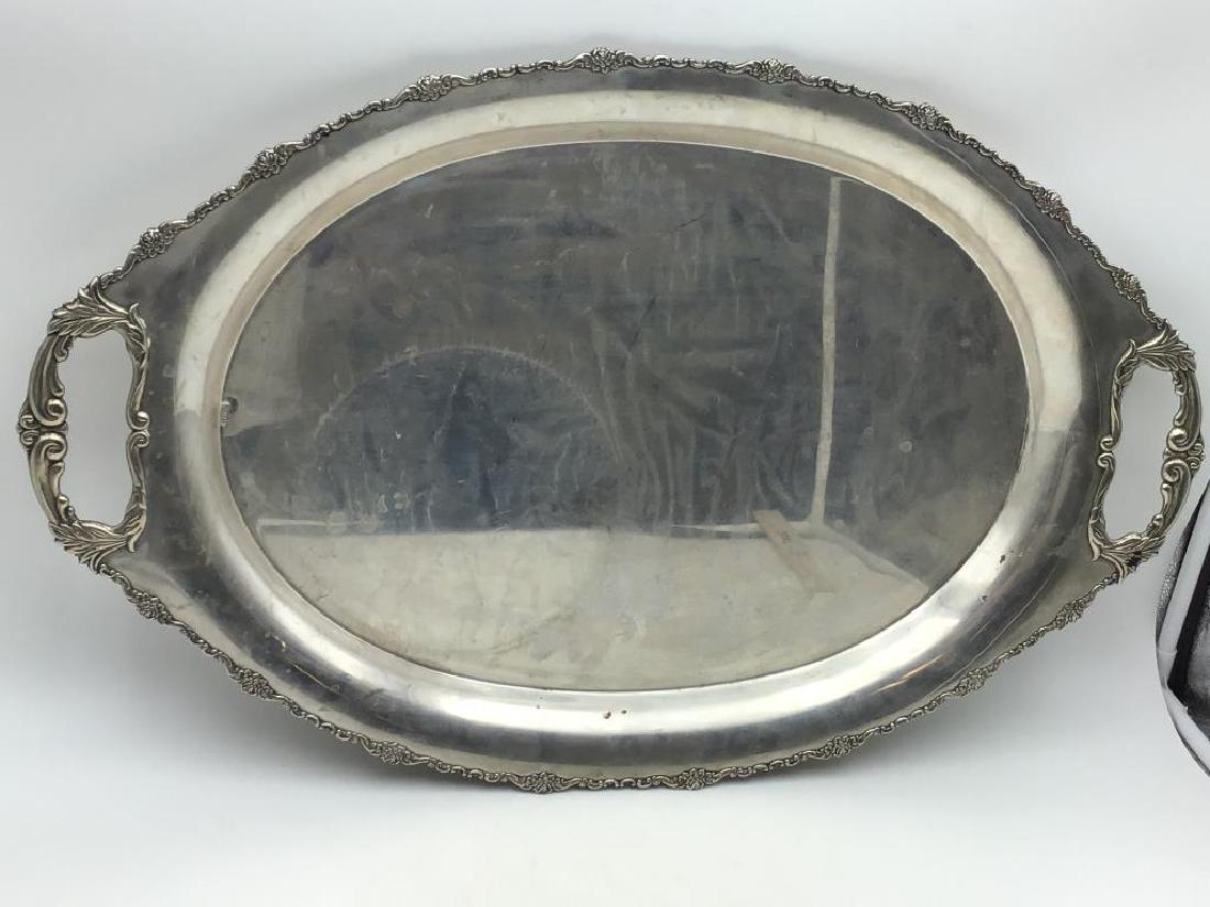 Large marked 835 silver platter: Large oval serving platter with two handles, decorated trim, markings with number 835 on top, also marked Japan nickel plate on bottom. Measures about 27 inches long by 17 1/2 inches wide. 65 ozt.