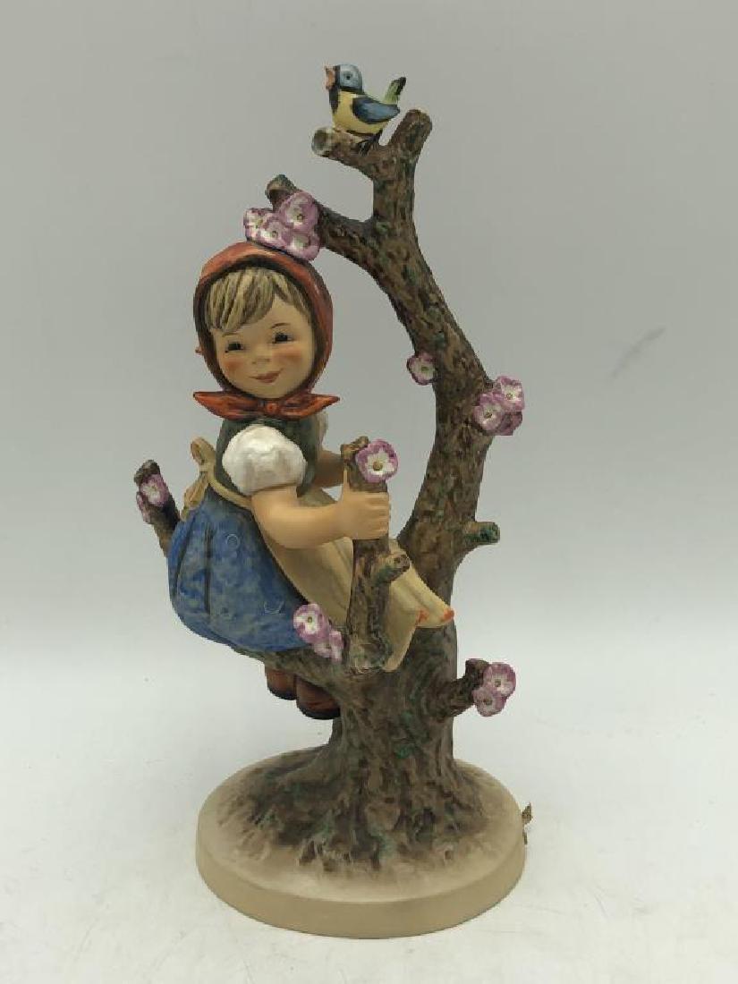 "Apple Tree Girl" Hummel Figure: Hummel figure featuring young girl in apple tree without title tag, M.J. Hummel signature on base, maker mark on bottom, "Goebel W. Germany" numbered 141/V dated 1968 good condition. Measures about 11