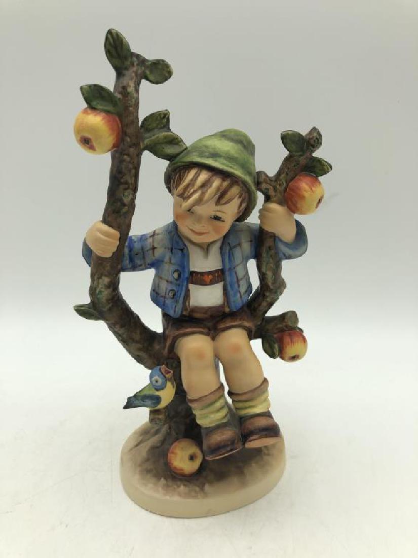 "Apple Tree Boy" Hummel Figure: Hummel figure featuring young boy in apple tree, M.J. Hummel signature on base, maker mark on bottom, "Goebel W. Germany" numbered 142/V, N. 94, dated 1968, good condition. Measures about 10.5 inches 