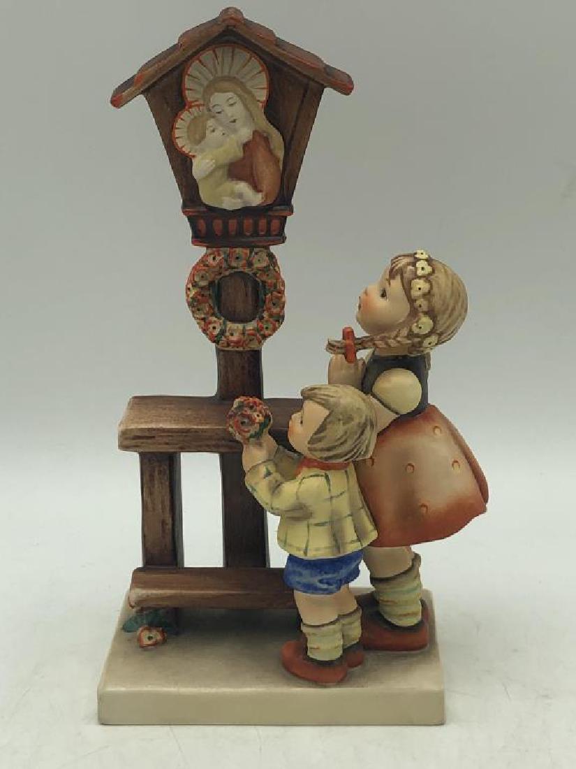 Praying children Hummel: Hummel figure featuring boy an girl praying to Madonna and Child. MJ Hummel signature on back of base, marked on bottom, "W. Germany" numbered 23/III, 34, good condition. Measures about 9 inches high 