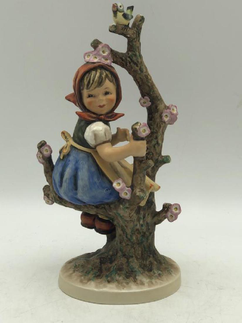 "Apple Tree Girl" Hummel Figure: Hummel figure titled "Apple Tree Girl", M.J. Hummel signature on base, maker mark on bottom, "Goebel W. Germany" numbered 141/V dated 1968, some crazing on underside. Measures about 11 inches high by 