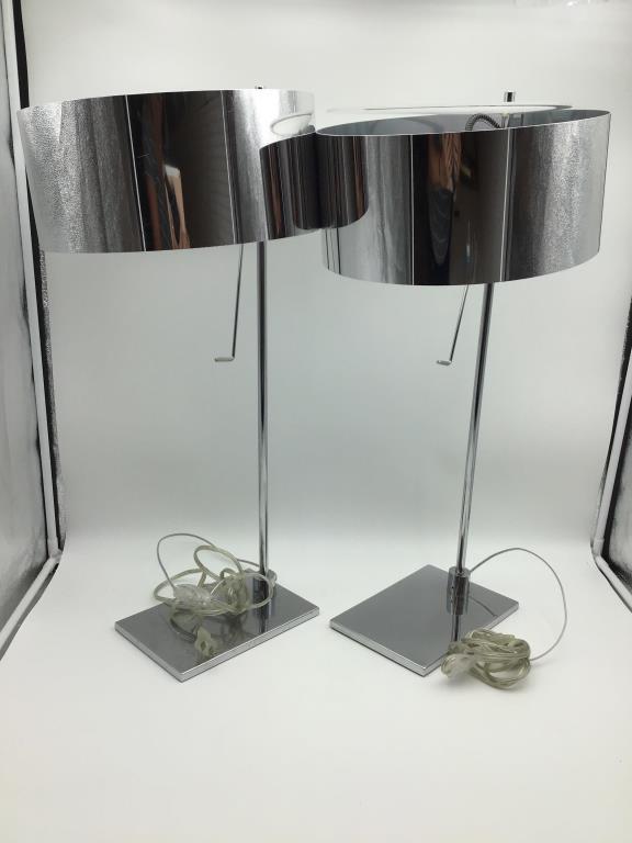 Pr. Mid Century Ligne Roset chrome table lamps: Ligne Roset, Pair of modern table lamps with chrome stand and shade, glass top to filter light. Light surface scratches on both. Measure approximately 24 1/2 inches high, base is 8 1/2 inches long by
