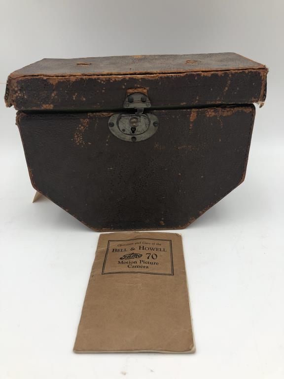Bell & Howell motion picture camera: Filmo 70 Motion Picture Camera by Bell & Howell, 16mm, Includes operation care manual and leather case with green felt lining. Case measures about 8 inches high by 10 inches wide by 5 1/2 inches deep.