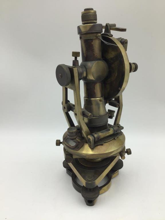 Antique Microscope: Brass Microscope with levels, compass, other instruments. Measures approximately 13 1/2 inches high by 5 1/2 inches wide. From the Raymond Bentley Estate.