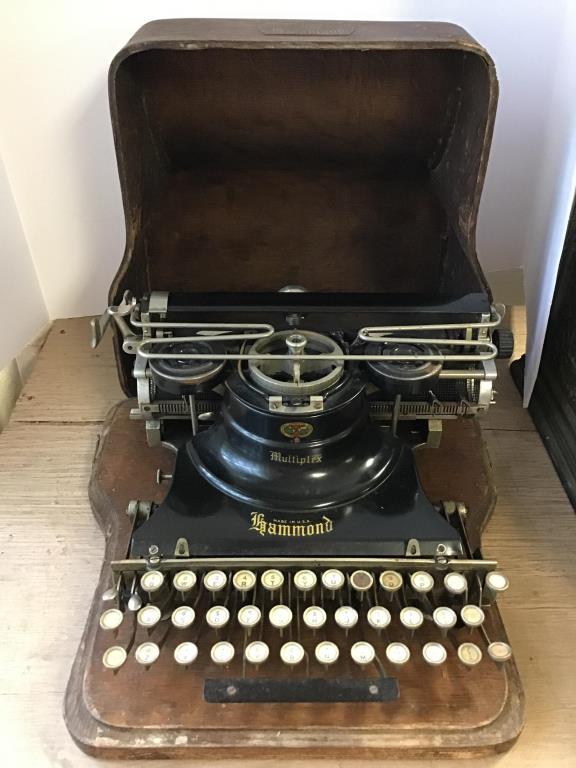 Antique Hammond Typewriter: Antique typewriter with label on front center reading “Made in the USA, HAMMOND” Stored in wood case. Letters on the keys are intact, Case measures 8 1/2 inches tall by 14 inches wide by 14 inches