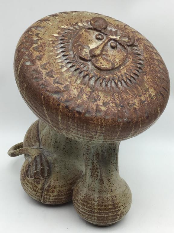 Art pottery Lion Sculpture: Artist mark on back by tail is a square in three sections with two dots, mark attributed to 20th c. Pennsylvania ceramic artist, Robert Blanchard. Good condition. Measures approximately 12 inches high