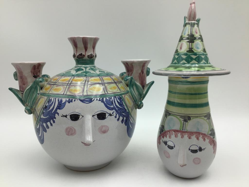 Bjorn Wiinblad Pitcher and Vase: Lot includes a pitcher with lid and bud vase signed on bottom by Bjorn Wiinblad, Danish painter, designer and artist in ceramics. Both pieces are decorated with face and sharp nose, signed by artist o