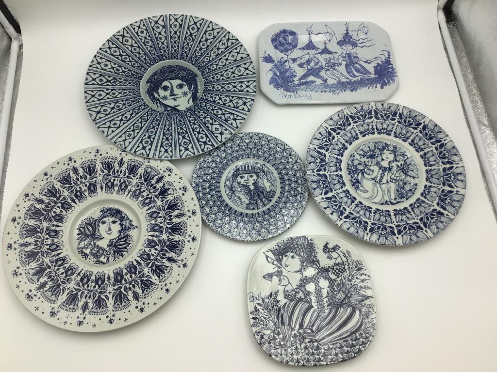 Six Bjørn Wiinblad Plates: Lot of six ceramic plates by Bjørn Wiinblad in blue and white with female figures and other patterns he is well known for using. Bottoms marked with artist name and Denmark, some numbered and/or titl