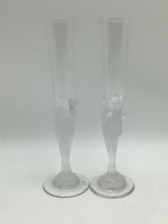 Pair Signed Erte Champagne Glasses : Pair of Deco style Champagne Glasses with female figures throughout, signed on bottom by artist, Erte, France (name also on side). Good condition, measure about 12" tall by 3.5" wide across bottom.