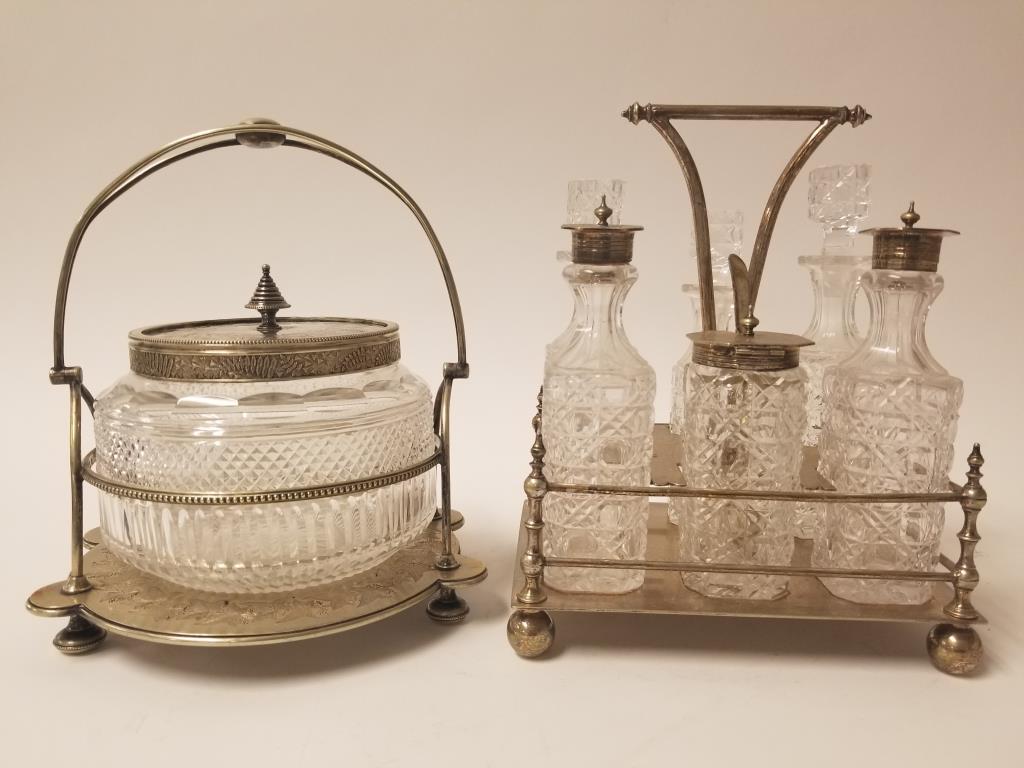 Silverplate covered serving dish & cruet set: Crystal bowl w/ silver plate trim, lid and handled carry rack. Crystal cruet set, with silverplate covers and carry rack. Both are 9 inches tall.