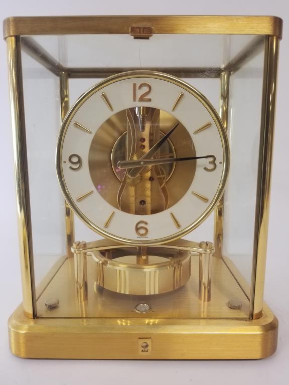 Jaeger LeCoultre Atmos mantle clock: Swiss made clock, glass and brass case. Measures 9 inches x 8 inches x 6 inches