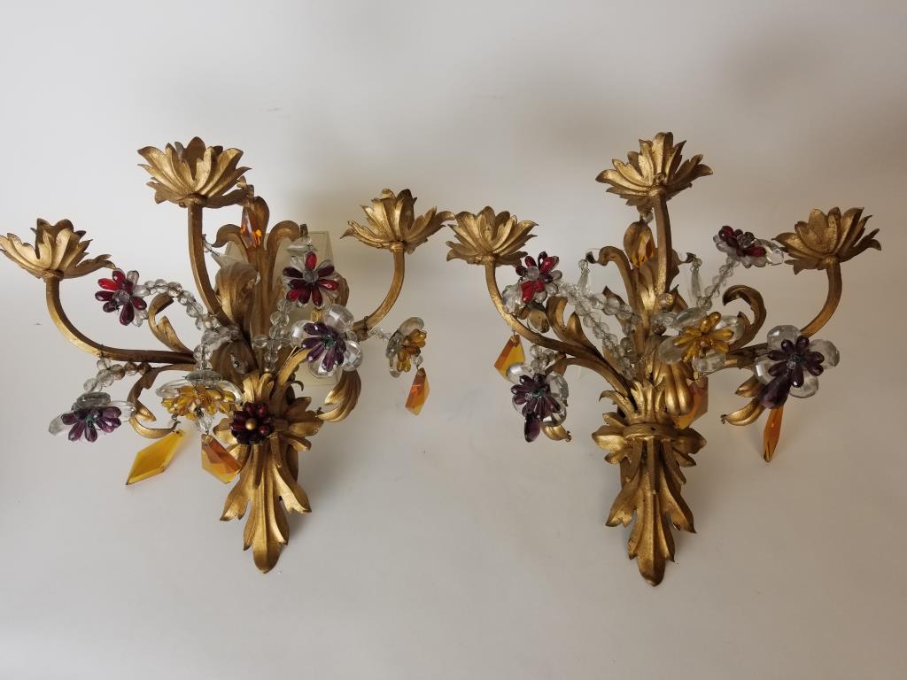 Pair of metal 3 lite sconces with many crystals: Painted metal with clear, ruby, purple and amber crystals. Measures 14 inches tall each