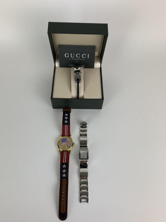 Three Time Pieces including Gucci: Gucci 6100L wrist watch with thin black leather band in Original box with paperwork, also in the lot Citizen Quartz mother of pearl face wrist watch and Valdawn stainless steel wrist watch with Americ