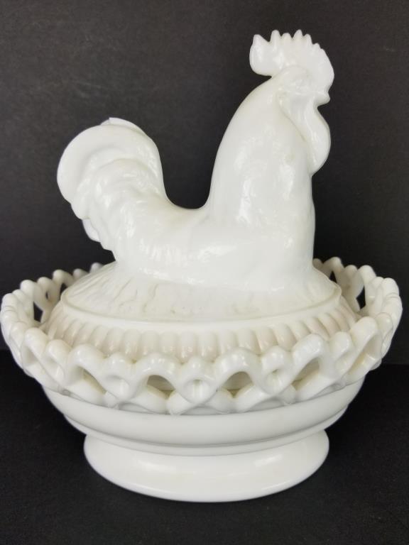 Imperial glass hen on a nest dish: Imperial glass chicken or rooster on a nest covered dish. Measures 8 inches tall.