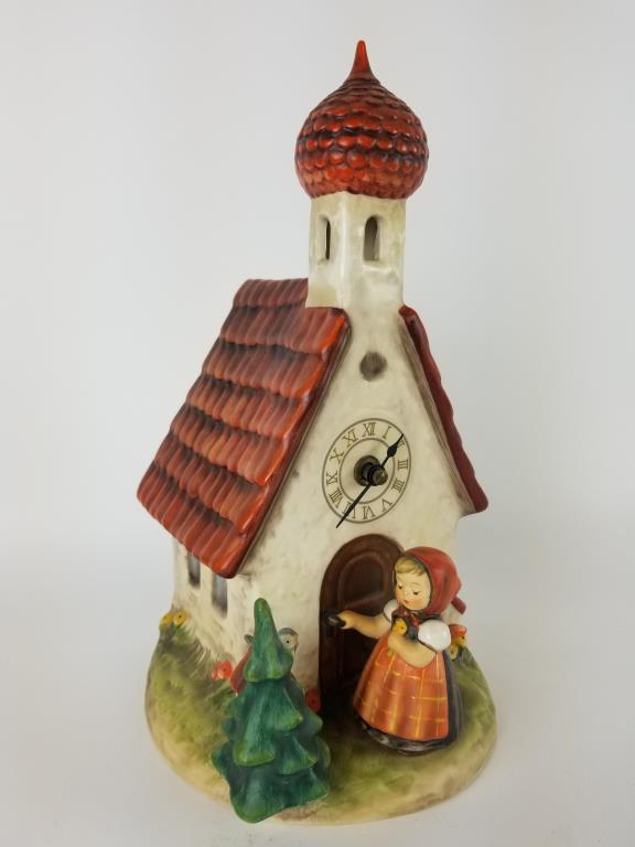 Hummel figurine Chapel Time: Hummel figure with clock, Chapel Time. Measures 12 inches tall.