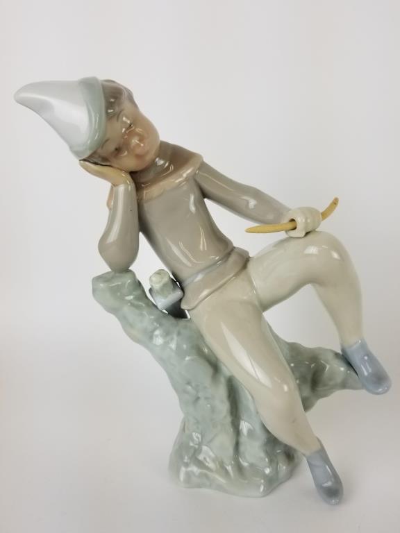 Lladro Sleeping Robin Hood figurine: Robin Hood at Rest figure. Measures 7 inches tall.